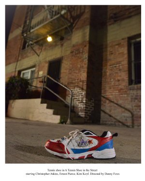 A tennis shoe in the street